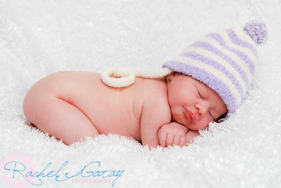 Newborn baby sleeping with hat in Rockville MD