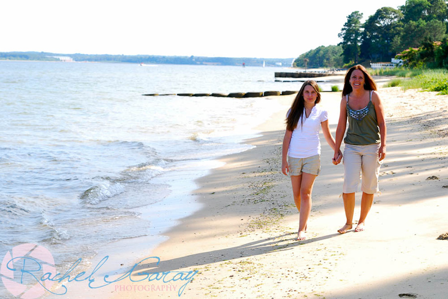 Mother and daughter having their pictures taken on the beach